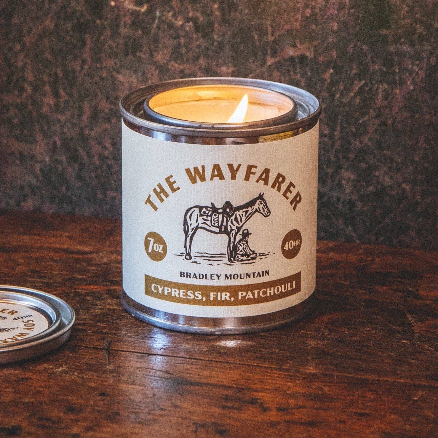White candle with scent of cypress, fir, patchouli