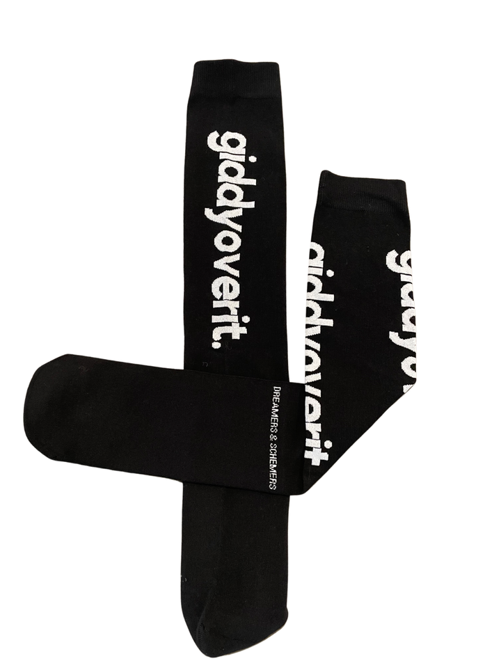 Black knee high socks with white text "giddy over it"