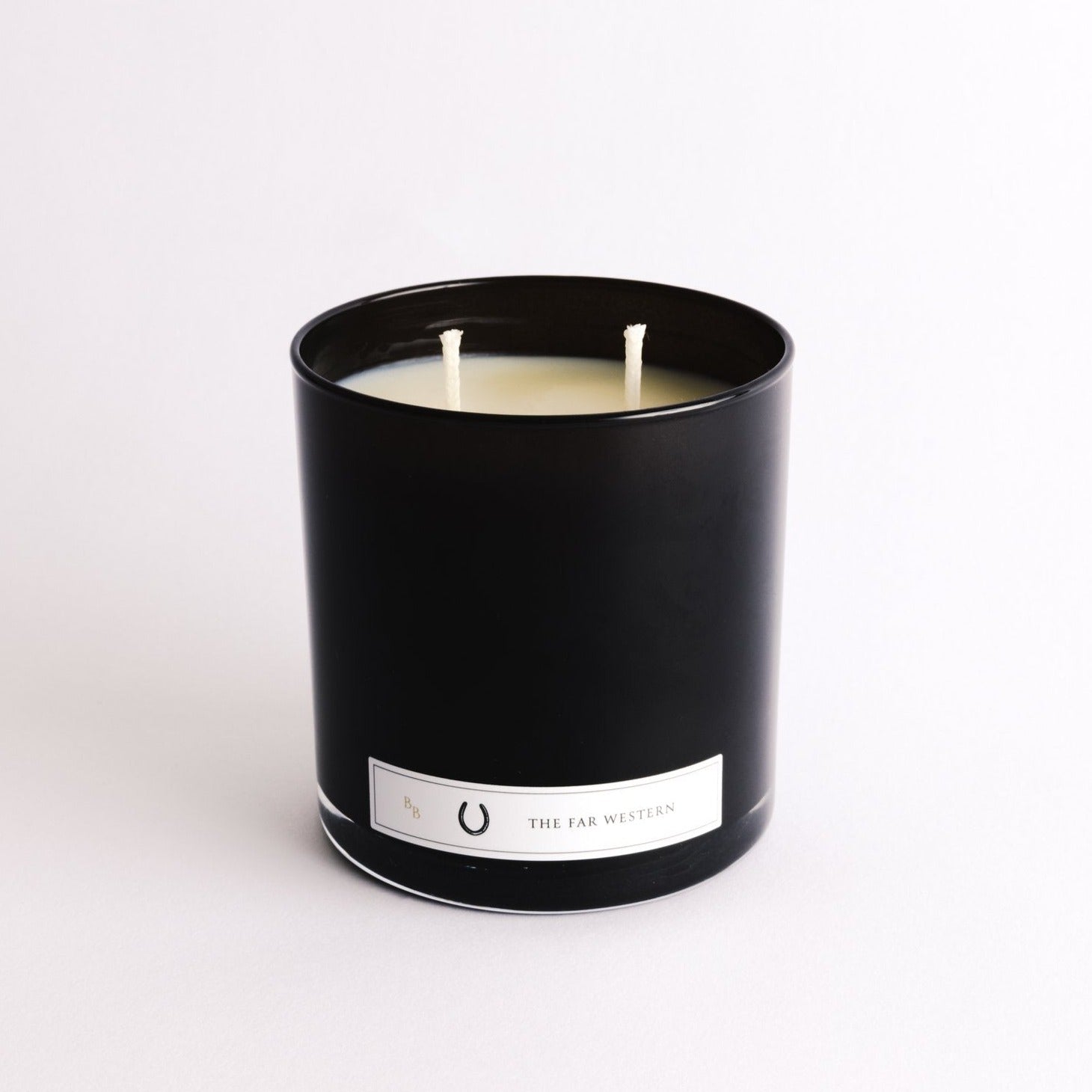 Far Western candles in black container. Two wicks