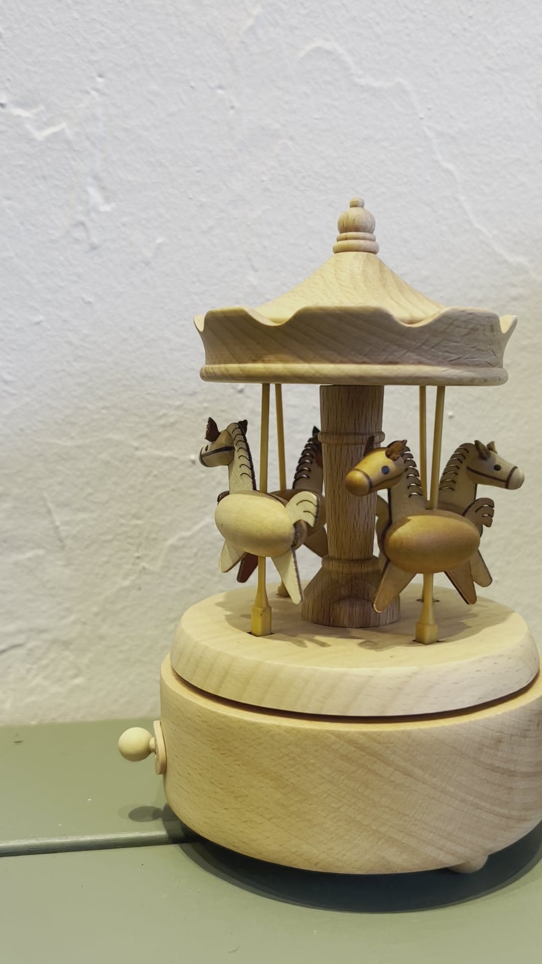 Small horses on carousel.