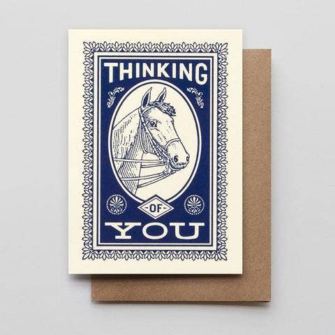 White Greeting Card. Blue detailing of a horsehead and text "Thinking of You"