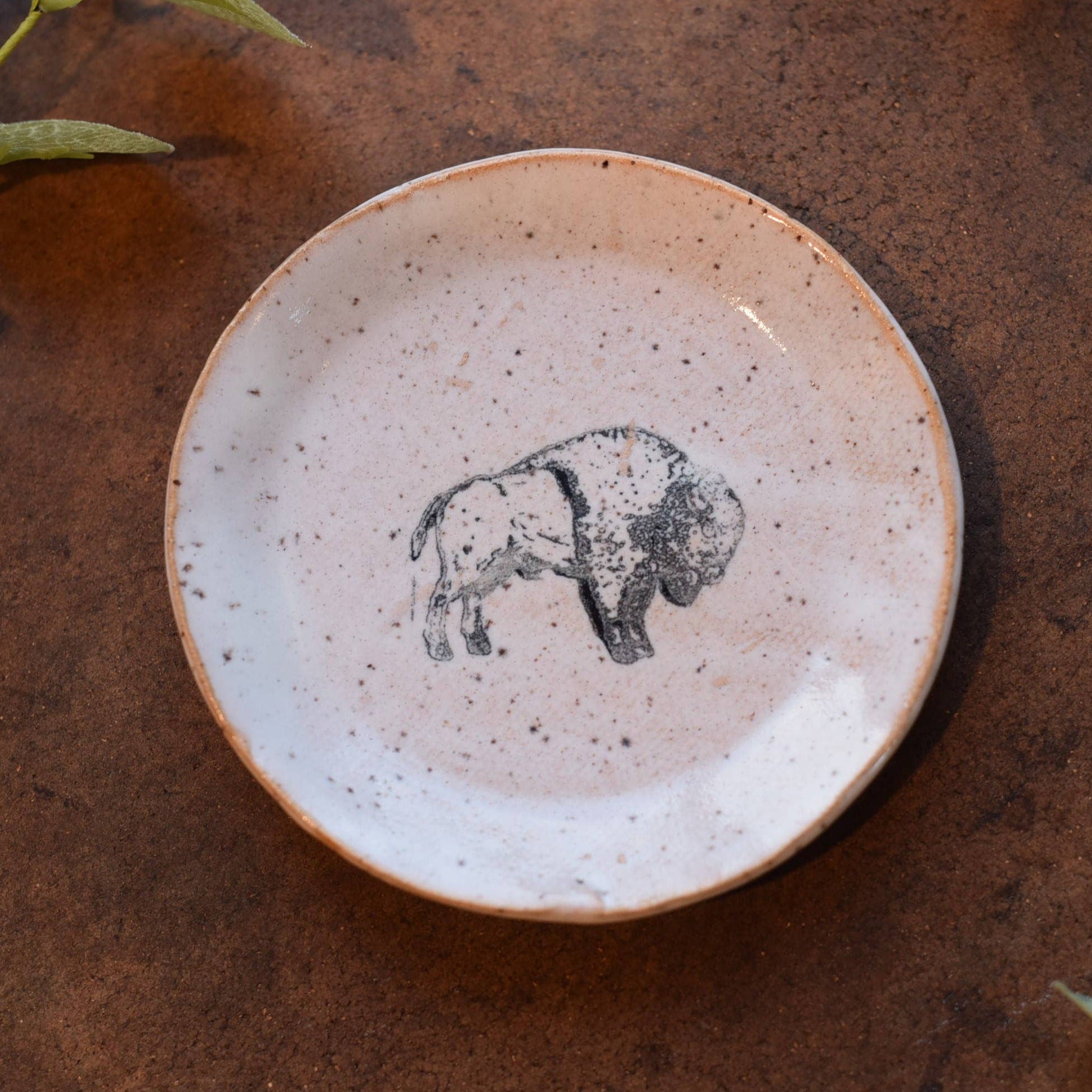 White small plate with printed buffalo in center